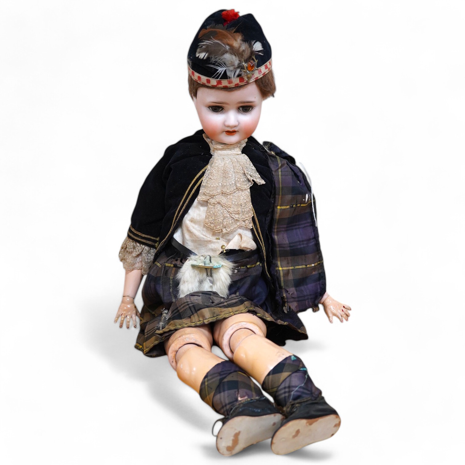 A Schoenau & Hoffmeister bisque doll, mould 1909, with sleeping eyes and open mouth, jointed wood and composition body, in a tartan outfit, 60cm. Condition - good.